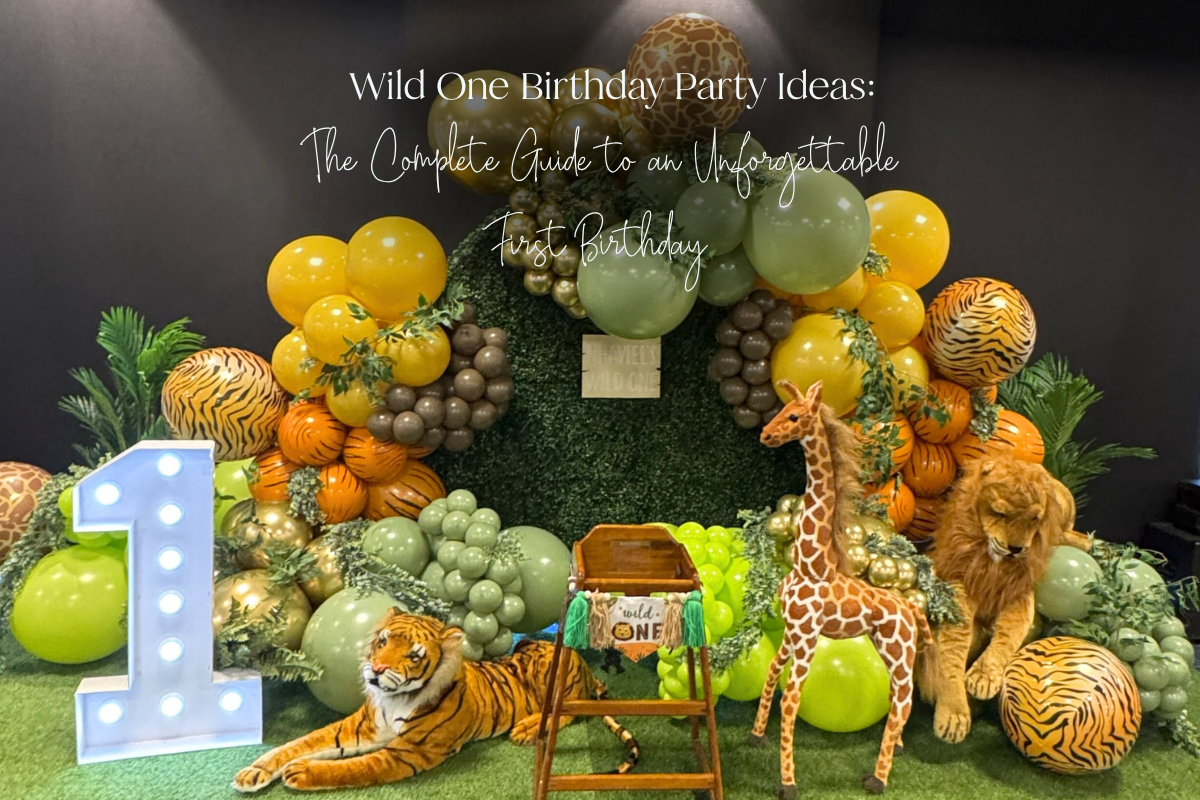 Wild One birthday party setup with green balloon garland  decorations